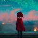 Katie Mitchell looks out at a burning, smoky landscape as blue sparks soar overhead.
